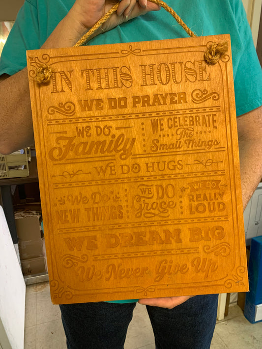 “In This House” sign